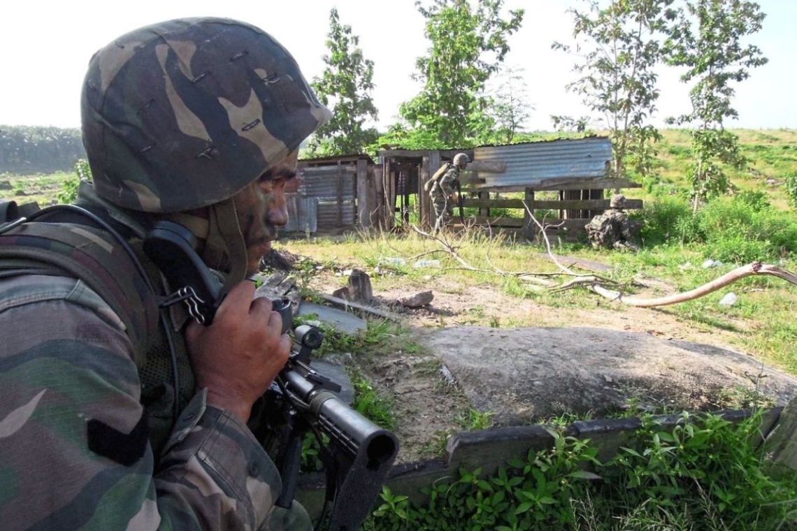 A security force at Kampung Tanduo in Lahad Datu in a sweeping and mopping operation to flush out the Sulu gunmen